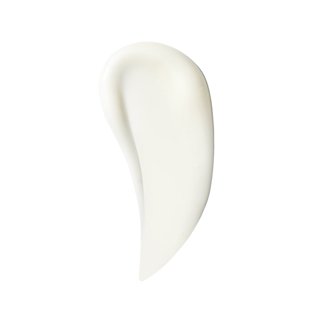 Texture of the probiotic Biome Barrier cream is spread on a white background, developed by board certified dermatologist and skin longevity expert Dr. Liv Kraemer