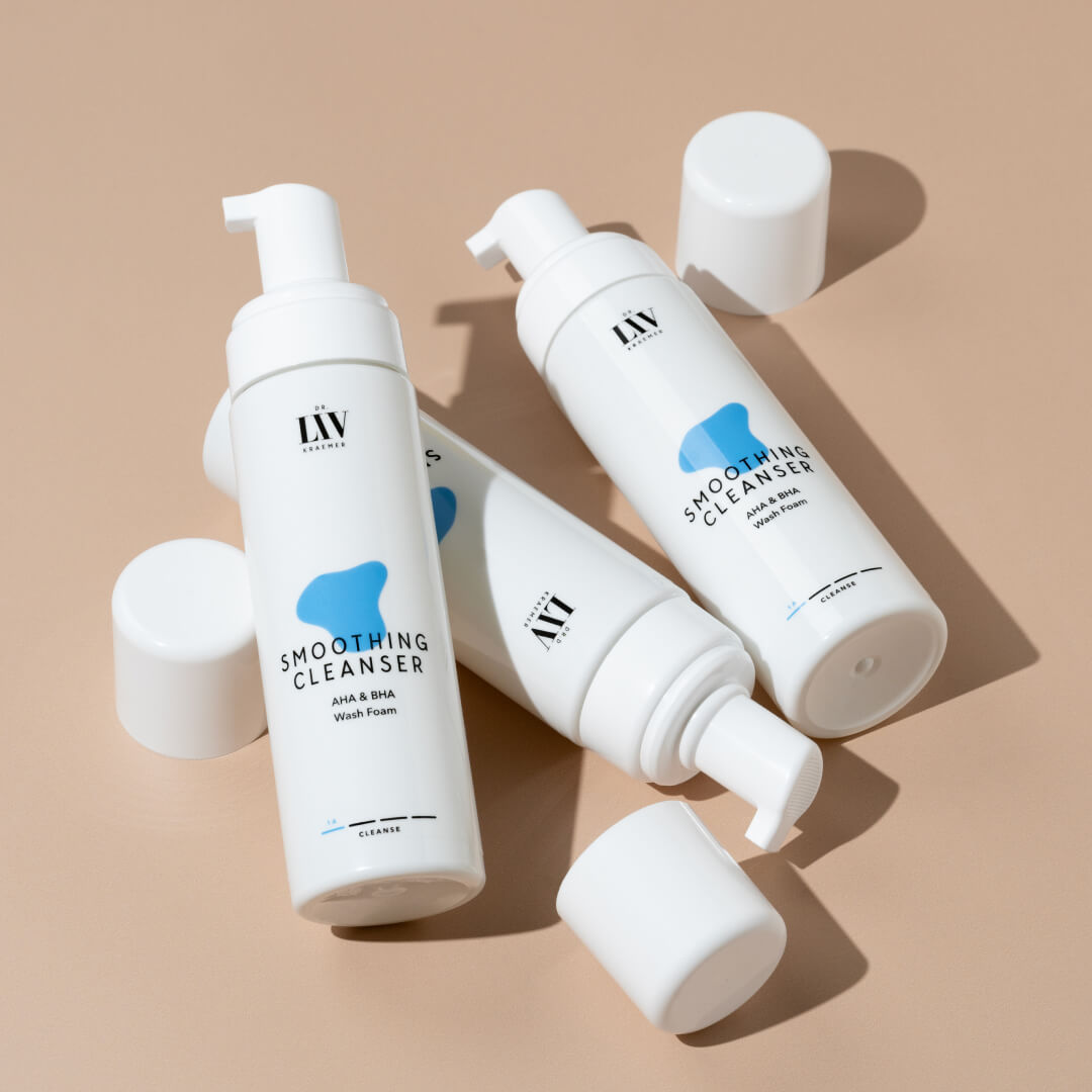The Smoothing Cleanser AHA&BHA Wash Foam developed by board certified dermatologist and skin longevity expert Dr. Liv Kraemer in front of a beige background.