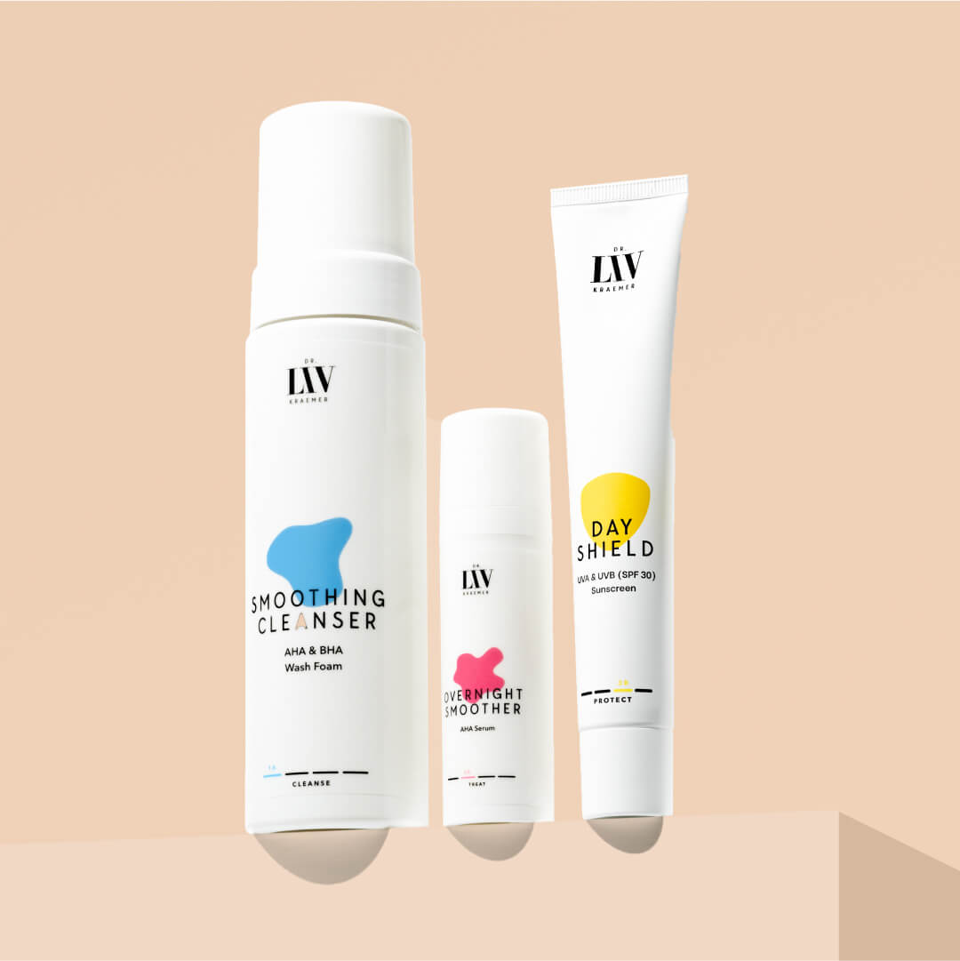 The Smoothing Cleanser, Overnight Smoother and Day Shield developed by board certified dermatologist and skin longevity expert Dr. Liv Kraemer in front of a beige background