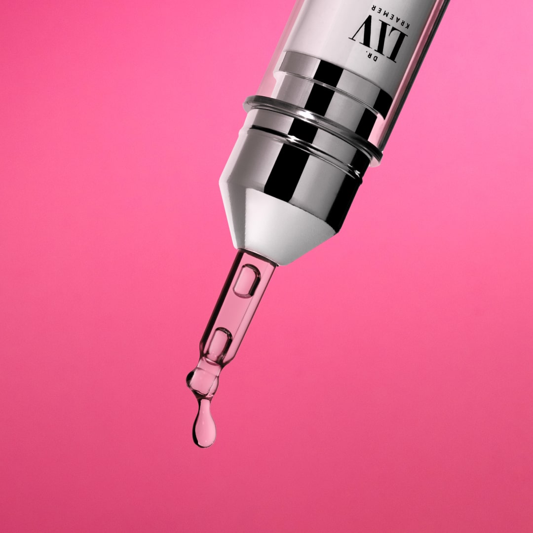 Redness Relief - an Azelaic Acid booster for redness, dark pimple marks and rosacea-prone skin; developed by board certified dermatologist and skin longevity expert Dr. Liv Kraemer against a pink background